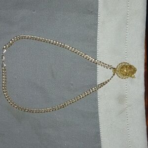 18k gold necklace, and Jesus pendant also 18k.